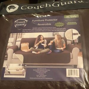 Brand new in unopened package XL couch protector.